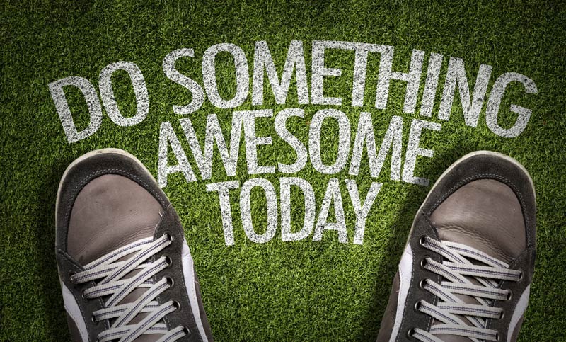 feet standing on a mat which says do something awesome today